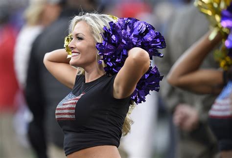 a baltimore ravens cheerleader performs during an nfl football game between the ravens and the