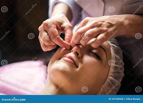 Calm Girl Having Spa Facial Massage In Luxurious Beauty Salon Stock