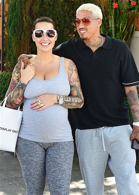 Amber Rose & Boyfriend 'AE' On Lunch Date As She Cradles Baby Bump ...