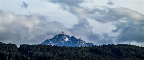 Download Wallpaper 2560x1080 Mountain Peak Clouds Forest Landscape