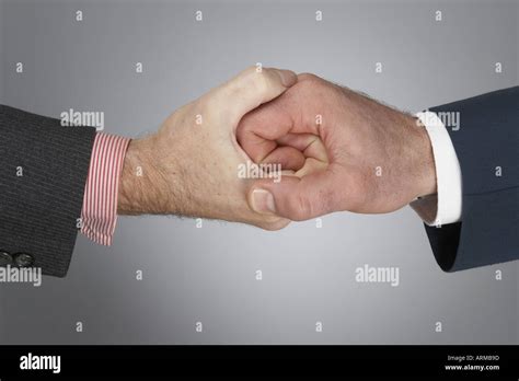 Strong Finger Grip Handshake Of Hand And Fingers Of Two Corporate