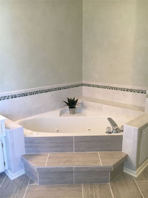Another way to fit a tub into a small bathroom is to consider installing a corner bathtub. Corner bathtub … | Tub remodel, Corner tub, Corner tub shower