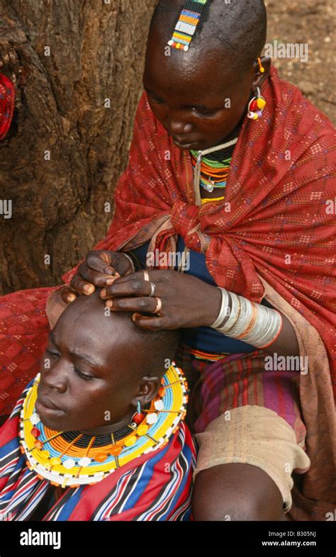 Karamojong Ethnic Women Preparing Head For Traditional Beadwork