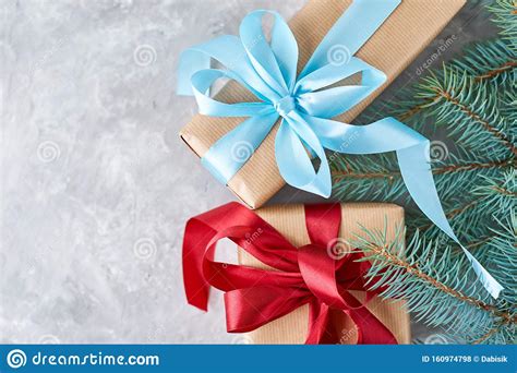 Trees with hooked branches tend to cost a bit less than their hinged counterparts, but they present more work for the owner each year. Gift Box With A Ribbon And Christmas Tree Branch, Top View ...