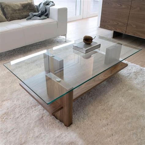 The coffee table that you need if you are looking for round glass coffee table: 29 Chic Glass Coffee Tables That Catch An Eye - DigsDigs
