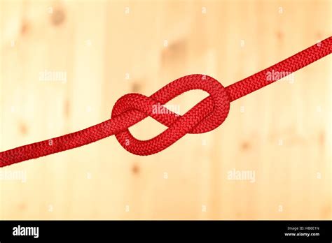 Red Rope With Wooden Background Stock Photo Alamy