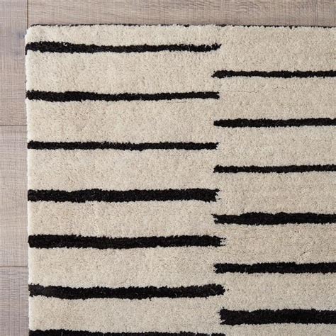 When we plan for the design and decoration of our home, the bathroom is not something that instantly comes to mind. Black and White Striped Hand Tufted Rug
