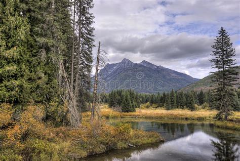 Small Pond Surrounded By Mountains Stock Photo Image Of Fall