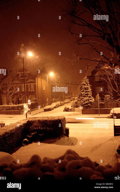 Snowy Street At Night Stock Photo Alamy