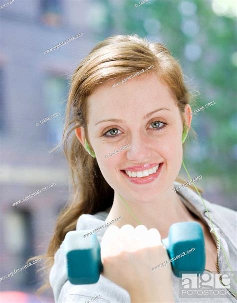 Young Woman Lifting Hand Weights Stock Photo Picture And Royalty Free