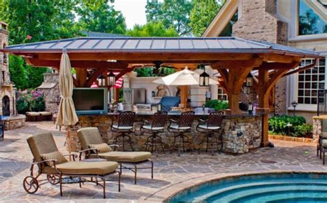 A backyard is an extension of what's going on inside your home. Outdoor pool and bar designs | Hawk Haven