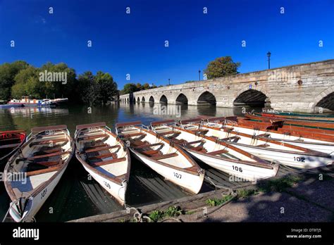 A Line Of Rowing Boats For Hire Moored By The River Avon Stratford