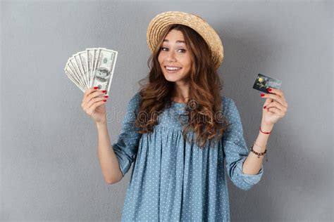 Amazing Young Pretty Woman Holding Money And Credit Card Stock Image