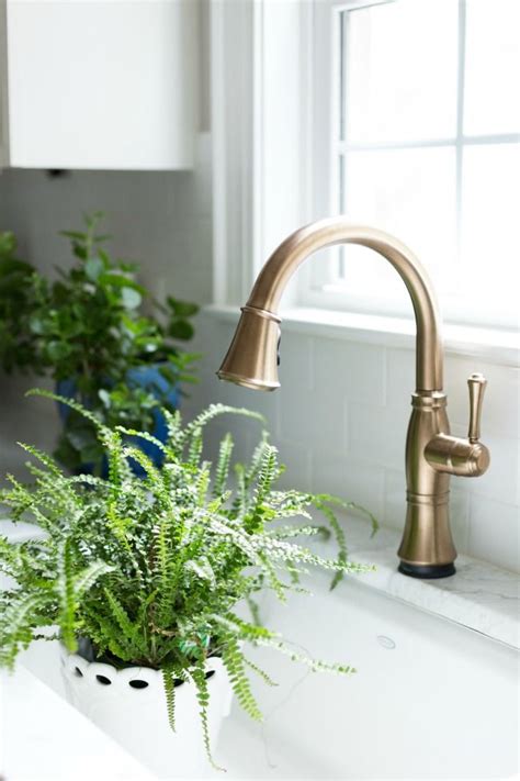 Keeping bronze bathroom fixtures looking shiny and new requires several maintenance and care steps, as moisture and harsh cleaning solutions can easily damage bronze hardware. Our White And Gold Kitchen Makeover | Gold kitchen, Gold ...