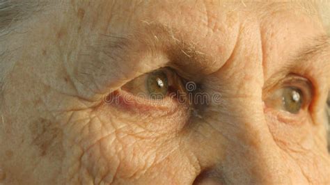 Close Up Portrait Of A Old Woman`s Gaze Emotions Of Grandmother Stock
