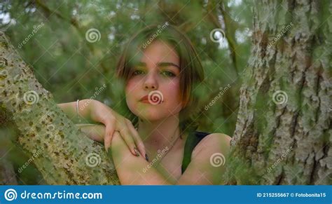 Attractive Girl Posing Behind Tree In Forest Stock Image Image Of Nature Close 215255667