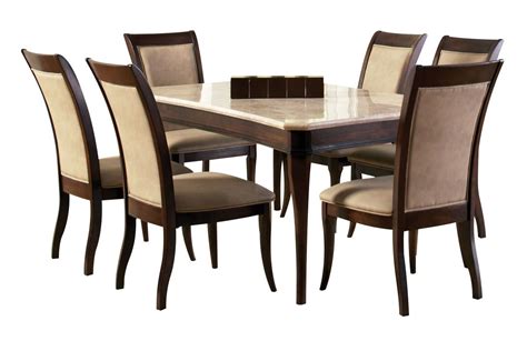It features a trestle style table with unique cross panel legs and nail head accents. Marseille Dining Table + 6 Side Chairs at Gardner-White