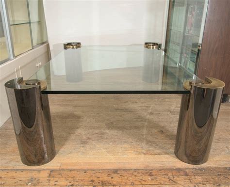Karl Springer Glass Top Coffee Table With Cylindrical Chrome And Brass Legs At 1stdibs