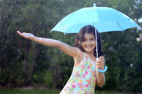 Young Girl Enjoying The Rain Stock Photo Image Of Hold Fashion 31987034