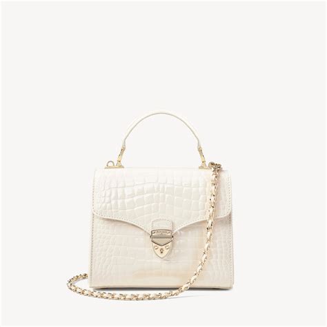 aspinal of london italian full grain leather crocodile print midi mayfair bag in natural lyst