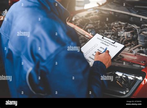 Car Mechanic Inspecting Vehicle Auto Inspection Concept Stock Photo