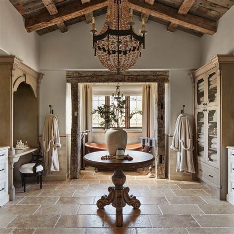 A Bath Room With A Chandelier Hanging From The Ceiling