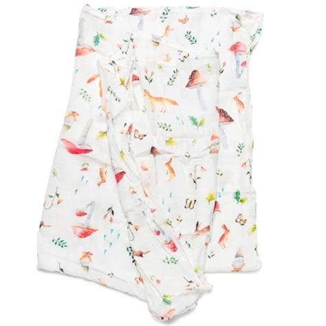 Two Baby Swaddles With Colorful Birds And Leaves On Them One Is White