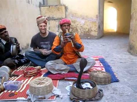 Snake charming is the practice of appearing to hypnotize a snake (often a cobra) by playing and waving around an instrument called a pungi. Cobra Dancing to Flute - Jaipur, India - YouTube