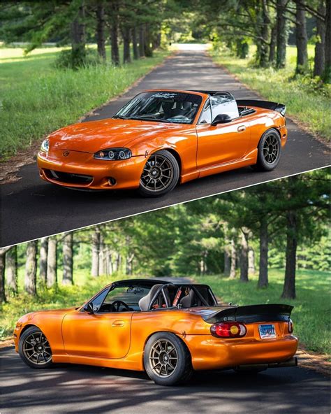 An Orange Convertible Car Parked On The Side Of A Road Next To Another