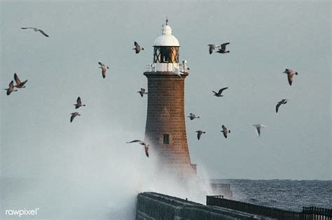 Download Premium Image Of Huge Wave Hitting A Lighthouse In Scotland