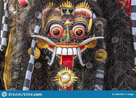 Traditional Balinese Barong Mask On Street Ceremony In Island Bali