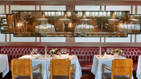 The arched ceilings of this hallway are stunning, and reminiscent of a quintessential castle dining hall. Le Pont de la Tour, Shad Thames, London | Abbey Upholsterers