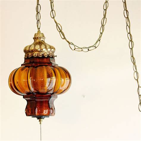 It features 4 hanging glass globes shaped like teadrops with 3d star and flower patterns all around. Vintage hanging light - hanging lamp - orange/amber globe ...