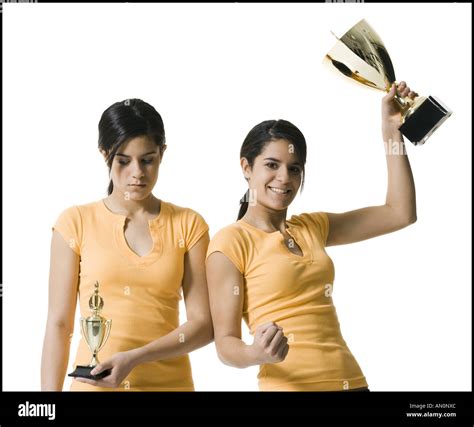 Close Up Of Two Teenage Girls Holding Trophies Stock Photo Alamy