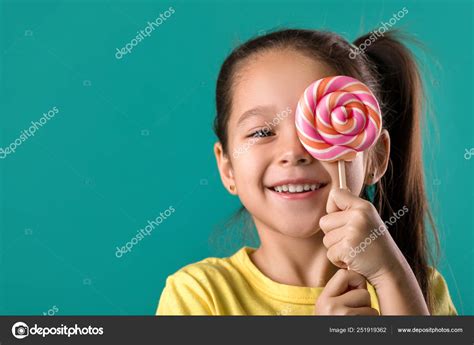 Beautiful Cute Little Girl With A Lollipop Stock Photo By ©erstudio