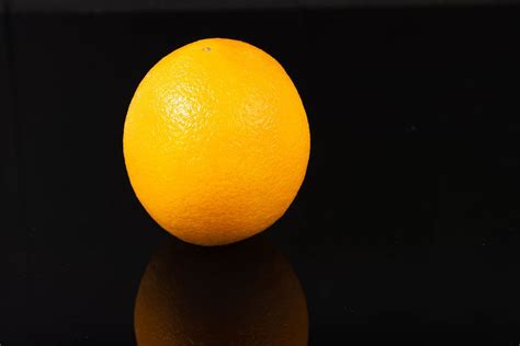 Whole Orange Fruit Above Reflective Black Background Flip 2019