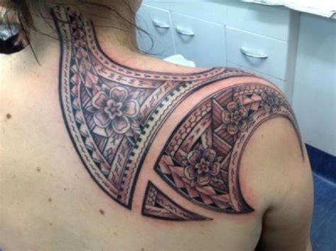 Awesome Shoulder Blade And Back Neck Tribal Flower Tattoo