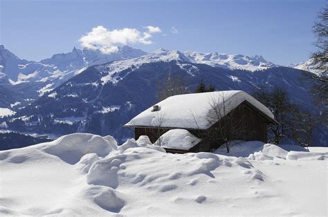 Snow Covered House In The Mountains In Winter Photograph