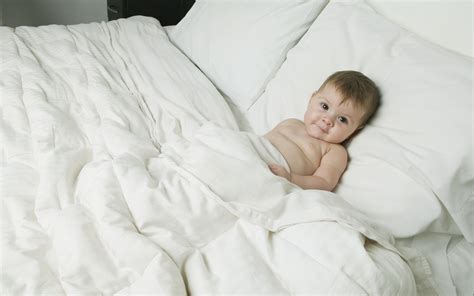Baby On The Bed Wallpapers And Images Wallpapers Pictures Photos