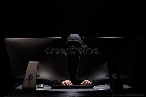 Hooded Hacker In Mask Sitting Near Stock Photo Image Of Caucasian