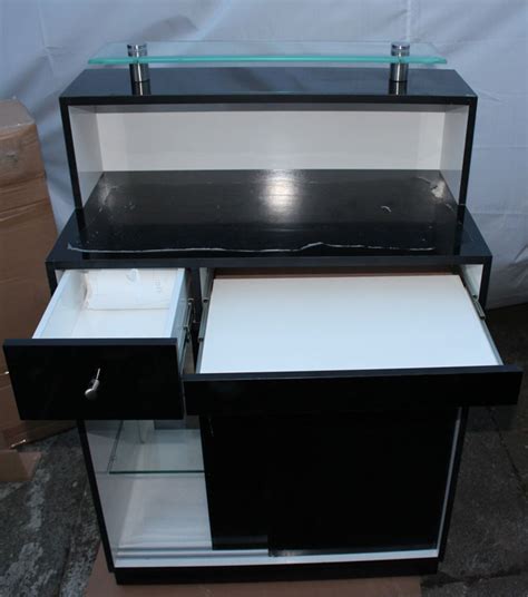 The most common black reception desk material is wood. Black Reception Desk - VB Nails