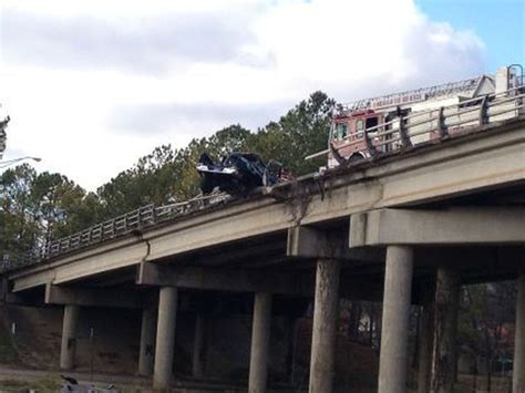Deadly Crash Leaves Car Hanging Over Bridge
