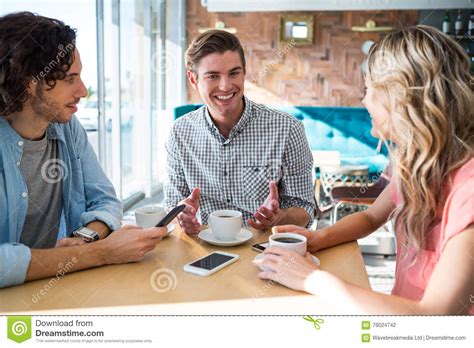 Friends Talking In The Coffee Shop Stock Photo Image Of Companionship