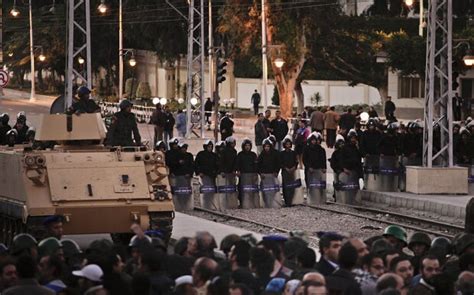 tens of thousands storm barricades at egypt s presidential palace