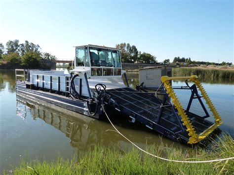 Harvester, in farming, any of several machines for harvesting; Weed Harvesters | Aquatic Control Engineering