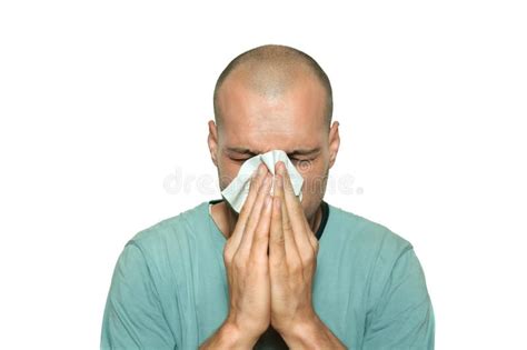 Young Man Sick From Common Cold Flu Blowing His Nose With Paper Tissue