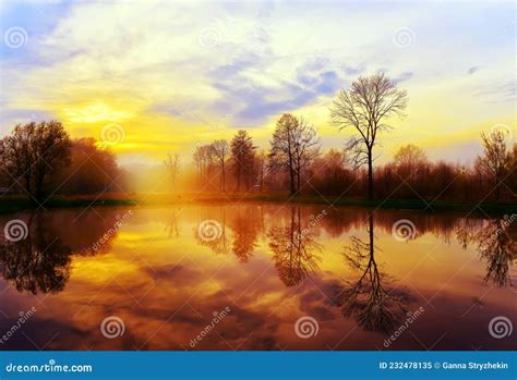 Foggy Mystical Sunrise On The Shore Of The Lake Smooth Surface Of The