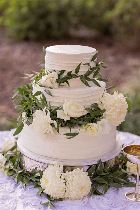White Buttercream Cake With Fresh Flower Accents