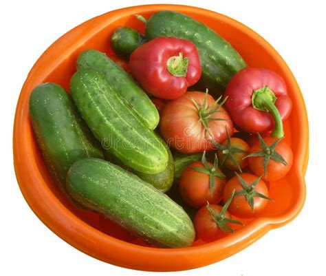 Tomatoescucumber And Pepper In Orange Plate Stock Photo Image Of