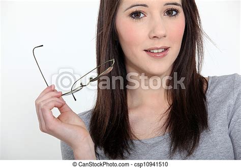 Young Woman Taking Off Her Glasses Canstock